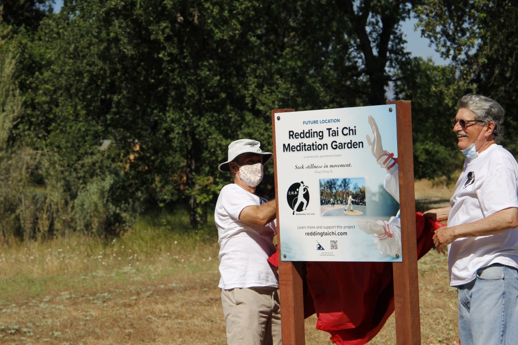 Bill C. and Iraja SD unveiling the Redding Tai Chi Meditation Garden "Future Location of" sign